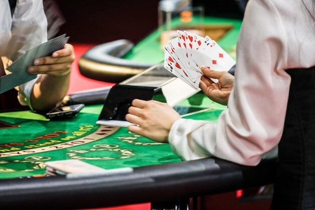 Live dealer at Wild Bandito table with cards displayed and multiplier indicator on screen